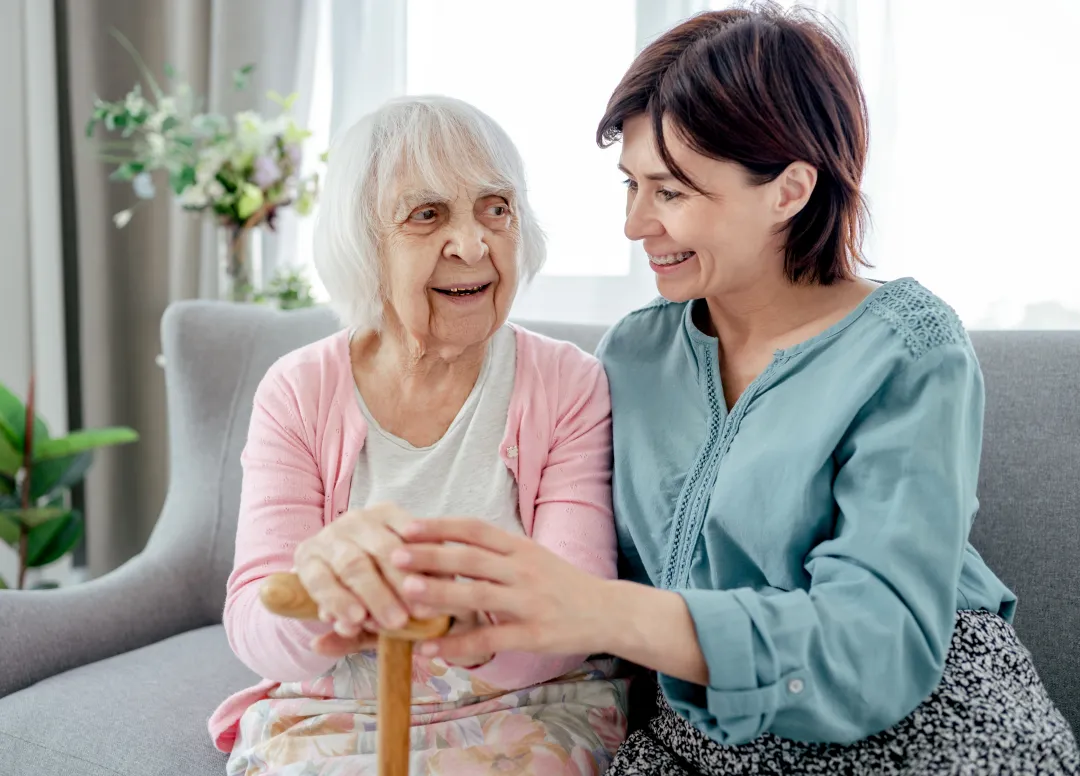 Elderly woman with carer