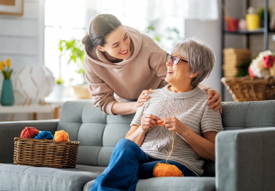 Elderly woman and carer